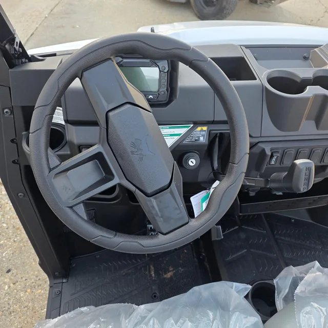 Steering wheel and switch panel close up inside a Bobcat UV34 utility vehicle at Dykes Motors, Collins, Mississippi