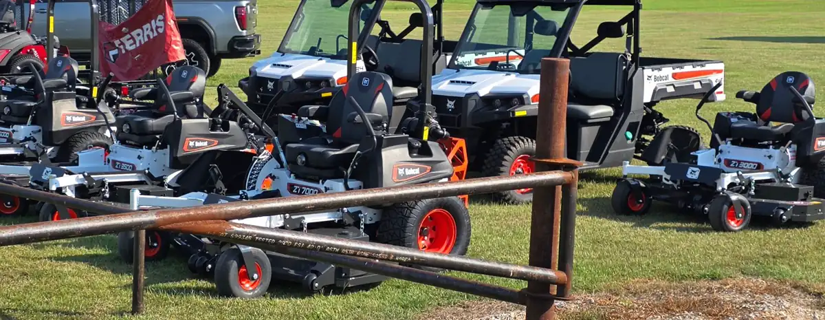 The equipment row at Dykes Motors — Bobcat ZT3500, ZT7000 and ZT3000 zero-turn mowers beside two Bobcat UV34 utility vehicles