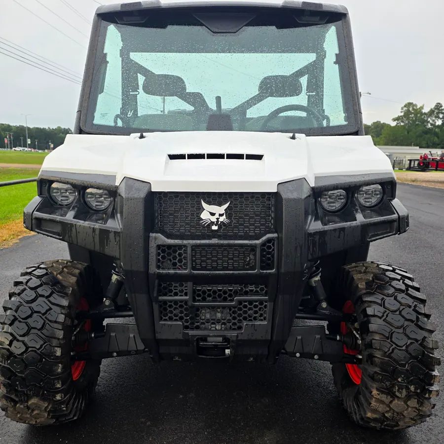 Bobcat UV34 fitted with a full glass cab and roof, photographed straight on from the front