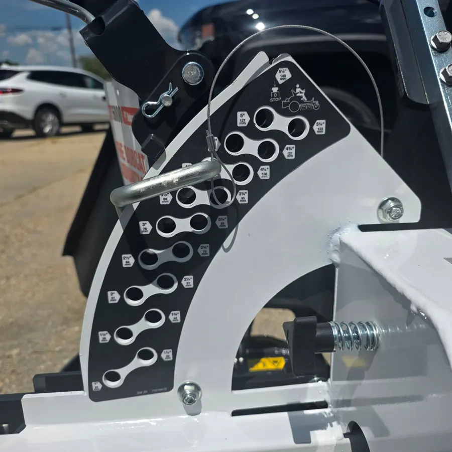 Close-up of the deck height adjustment plate on a Bobcat ZT zero-turn mower, showing the pin positions from 1 inch to 5.5 inches