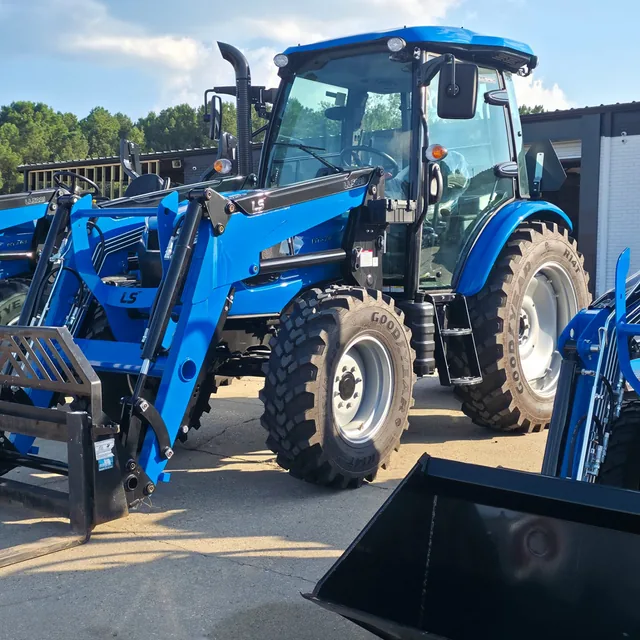 LS cab tractor with a front loader and bucket on the lot at Dykes Motors, Collins, Mississippi