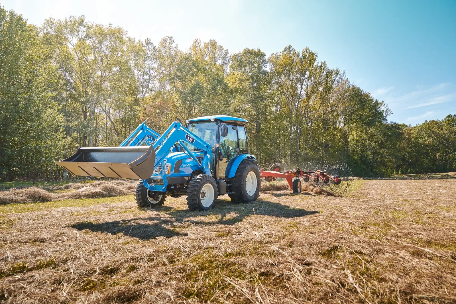 LS utility tractor working in the woods